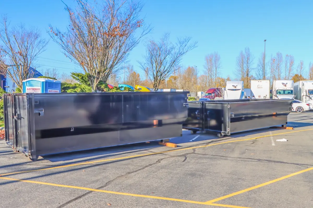 Professional dumpster rental service with roll-off container on residential driveway in Cayce